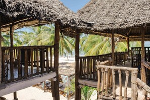Deluxe Quadruple Room, 1 Bedroom | Terrace/patio - Shanuo Beach Bungalows (Michamvi)