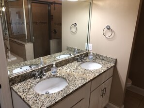 Combined shower/bathtub, towels, soap, toilet paper