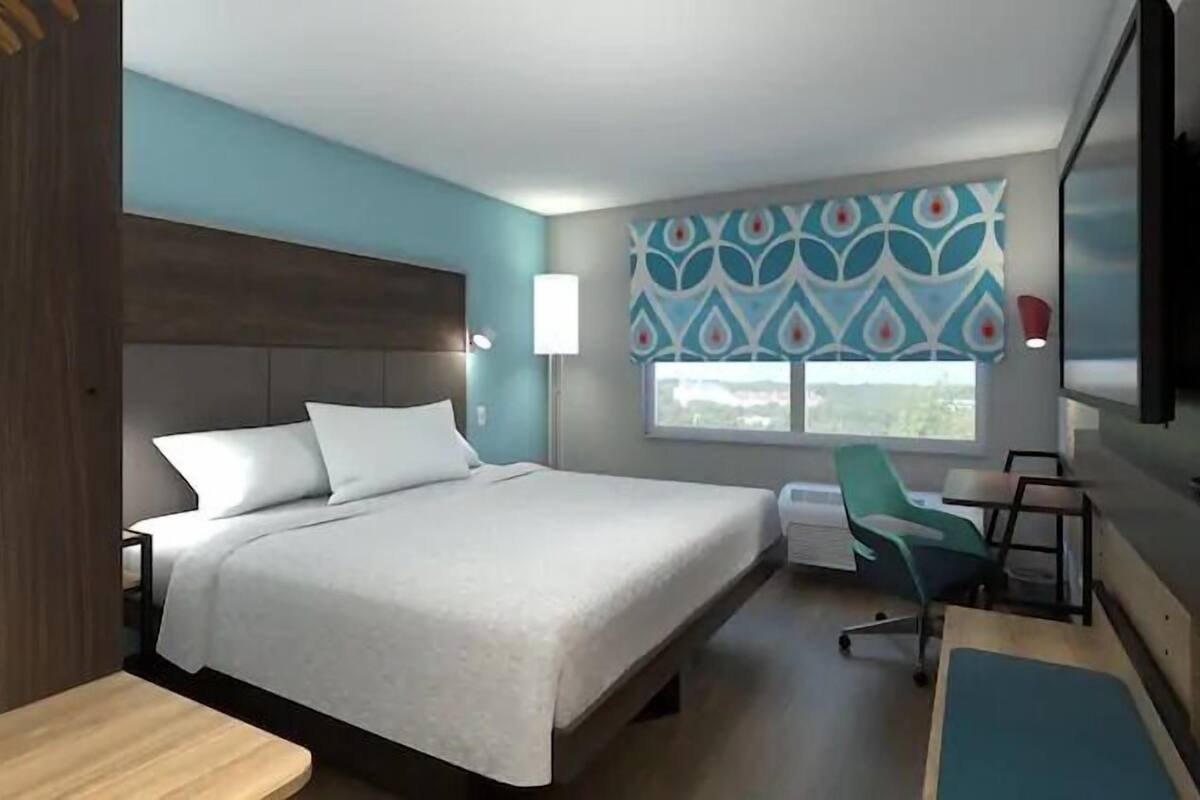 premium bedding, desk, laptop workspace, blackout curtains