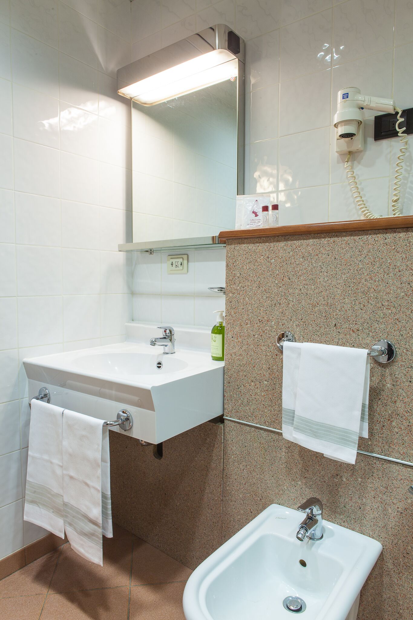 free toiletries, hair dryer, bidet, towels