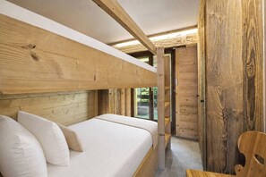 A wooden interior with a bunk bed and a wooden door. - App Savoleyres - Two Bedroom Apartment, Sleeps 6 (Riddes)