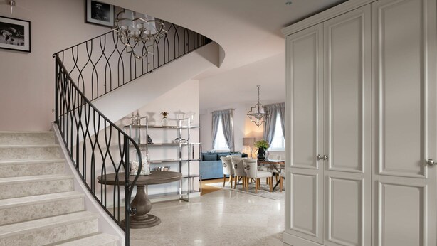 A spacious living area with a curved staircase, a dining table, and a kitchen in the background. - 4-bed Villa With Pool in Vabriga (Tar-Vabriga)