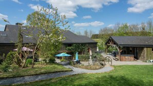 A residential area with stone buildings, a grassy lawn, and a small stream. - Quaint Apartment in Sensenruth With Terrace (Bouillon)