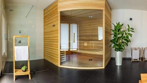 A modern interior with a curved wooden partition, a glass shower enclosure, a potted plant, and a small wooden stool with a plant. - Secluded Holiday Home with Hot Tub in Kozji Vrh (Cabar)