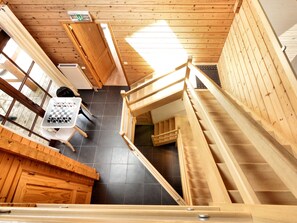 A wooden interior with a staircase, a chessboard, and a radiator. - Splendid Chalet near Durbuy (Durbuy)