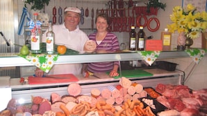 A deli counter with various meats and cheeses on display. - App. in Rotthalmunster Near the spa Triangle (Rotthalmuenster)