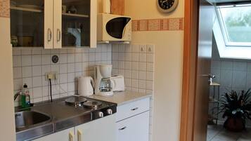 Apartment | Private kitchen | Electric kettle, high chair