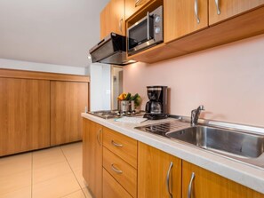 Fridge, microwave, cookware/dishes/utensils, dining tables - Apartment Mare 9 by Interhome (Rab/Kampor)