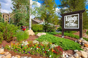 Experience the great outdoors at The Lodge at Steamboat, surrounded by vibrant flowers and lush landscaping.