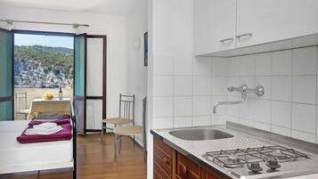 Fridge, cookware/dishes/utensils, dining tables