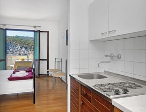 Fridge, cookware/dishes/utensils, dining tables
