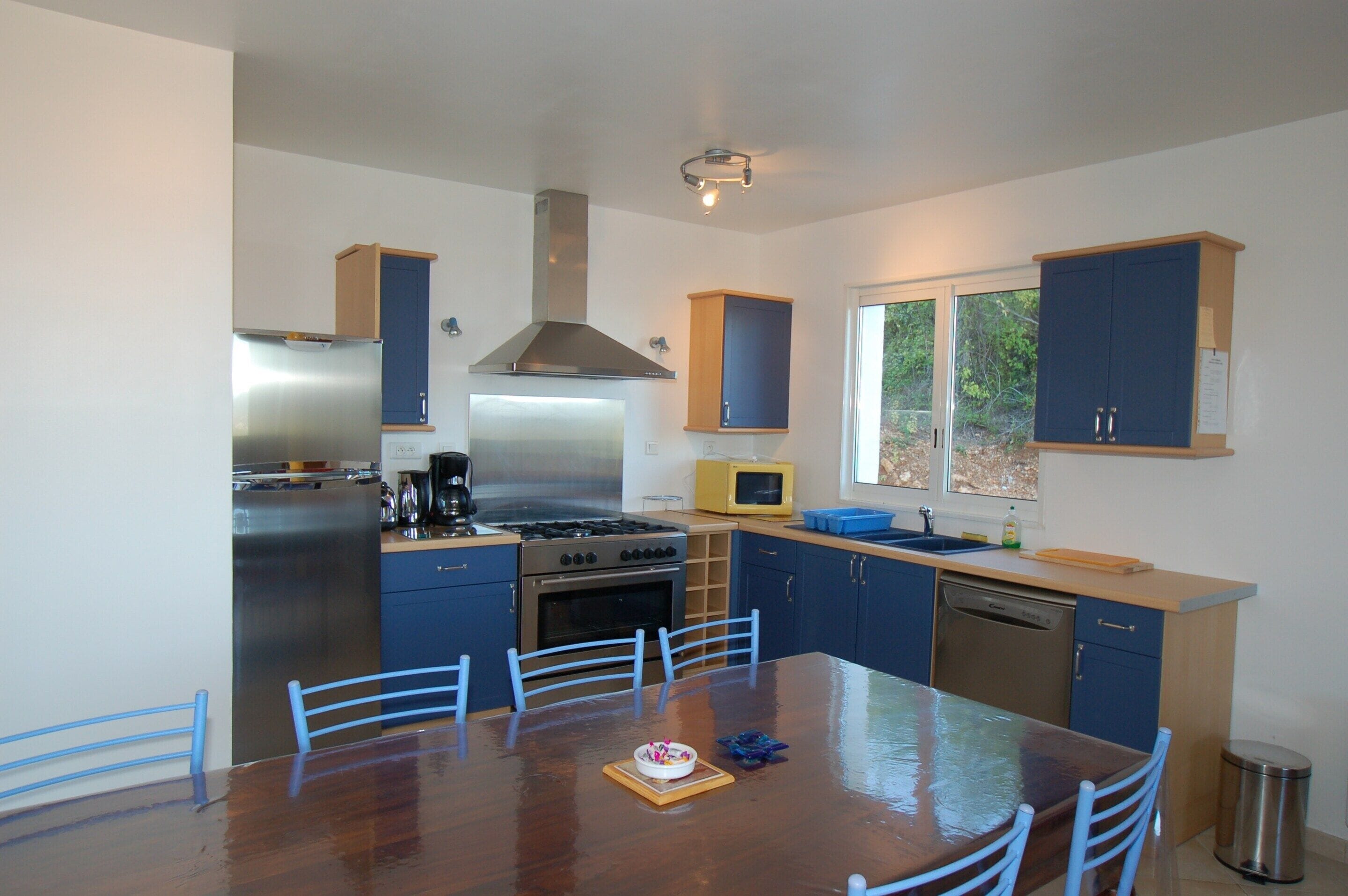 Villa | Private kitchen | Fridge, high chair