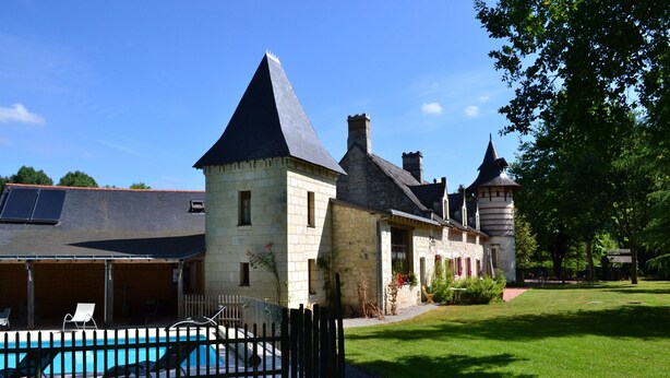 A stone building with a swimming pool, a covered patio, and a tower. - Romantic Loire Hideaway (Les Bois d'Anjou)