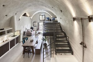 King suite with indoor plunge pool | Living room | 40-inch flat-screen TV with satellite channels, TV - Winery Hotel 1870 (Santorini)