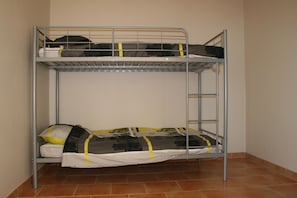 Sleep comfortably in this cozy space with a two-level bunk bed featuring a ladder for easy access.