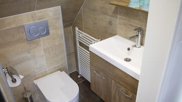 Superior Studio | Bathroom | Shower, hair dryer, towels, soap