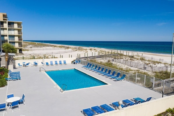 Relax by the pool overlooking the beach, where you can enjoy a refreshing swim or lounge on a comfortable chair.