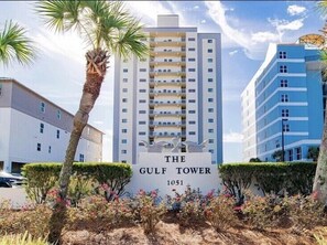 Experience the contemporary design of The Gulf Tower, featuring spacious balconies and beautifully landscaped surroundings.