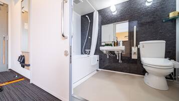 Combined shower/bathtub, deep-soaking bathtub, towels