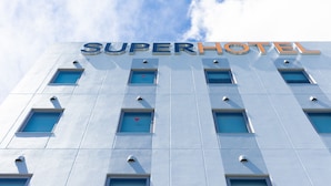 A hotel facade with the name "SUPERHOTEL" prominently displayed. - SuperHotel Yahaba-Eki Higashiguchi (Yahaba)