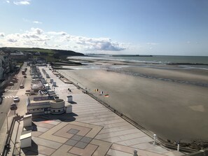 On the beach, sun-loungers