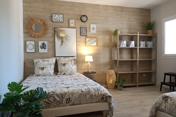chambre palmiers lit 1