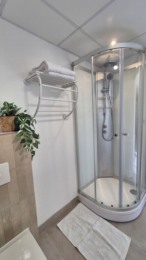 Shower, hair dryer, towels, soap