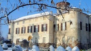A historic building with a symmetrical facade, large windows, and a central entrance. - A Castle Stay in Wine Country (Rocca Grimalda)