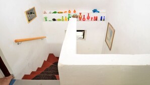 A staircase with a handrail and a wall decorated with various objects. - Idyllic Villa With Private Pool in Trebusin Czech Republic (Trebusin)