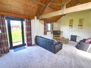 House | Living room | Fireplace, DVD player - Spacious Holiday Home in Llandinam near River (Caersws)