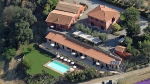 An aerial view of a property with multiple buildings, a swimming pool, and a parking area. - Farmhouse in Montalto Near Sandy Beach (Montalto di Castro)