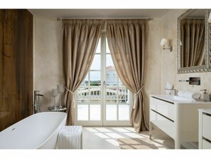 Villa | Bathroom | Bathtub, hair dryer, towels
