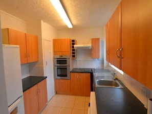 Apartment | Private kitchen | Fridge, microwave, oven, stovetop