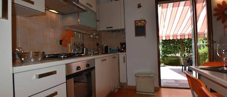 Villa | Private kitchen | Fridge, highchair, cookware/dishes/utensils