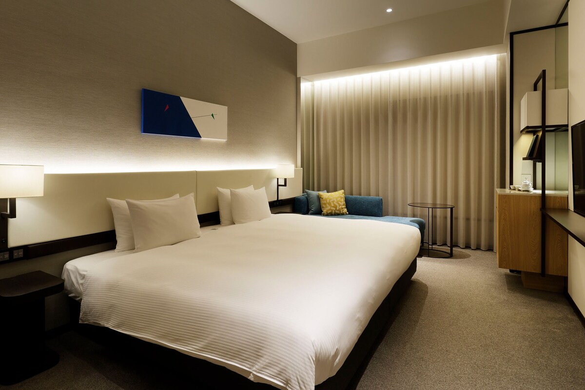 Habitación doble Deluxe | Ropa de cama de alta calidad y edredón 