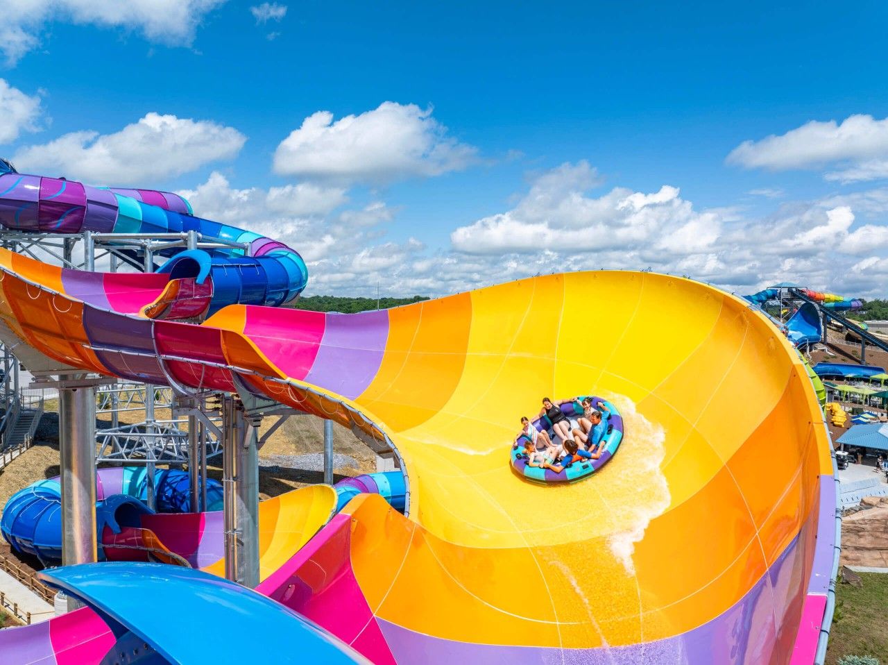 A water park with multiple water slides and a tube slide.