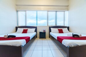 Family Room | Desk, free WiFi, bed sheets - RedDoorz Plus @ E Rodriguez Corner Banawe (Quezon City)
