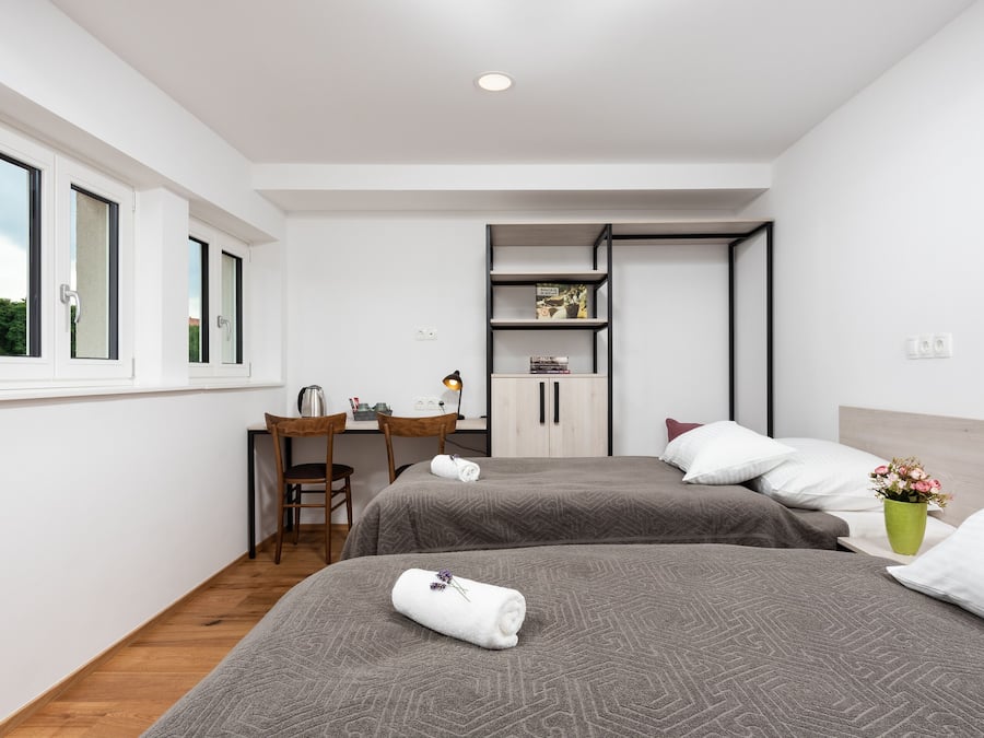 Premium bedding, individually furnished, desk, laptop workspace