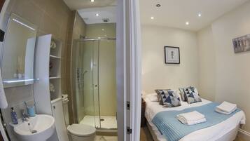 Combined shower/tub, hair dryer, towels, soap