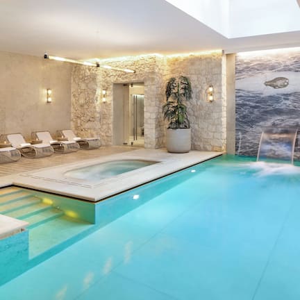 Indoor pool, open 7:00 AM to 10:00 PM, sun loungers