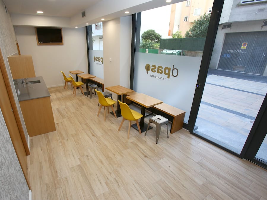 Single bed in 20 beds shared dormitory, shared bathroom | Living area | IPod dock, MP3 dock