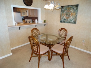 Enjoy meals in this cozy dining area with a round table and four comfortable chairs.