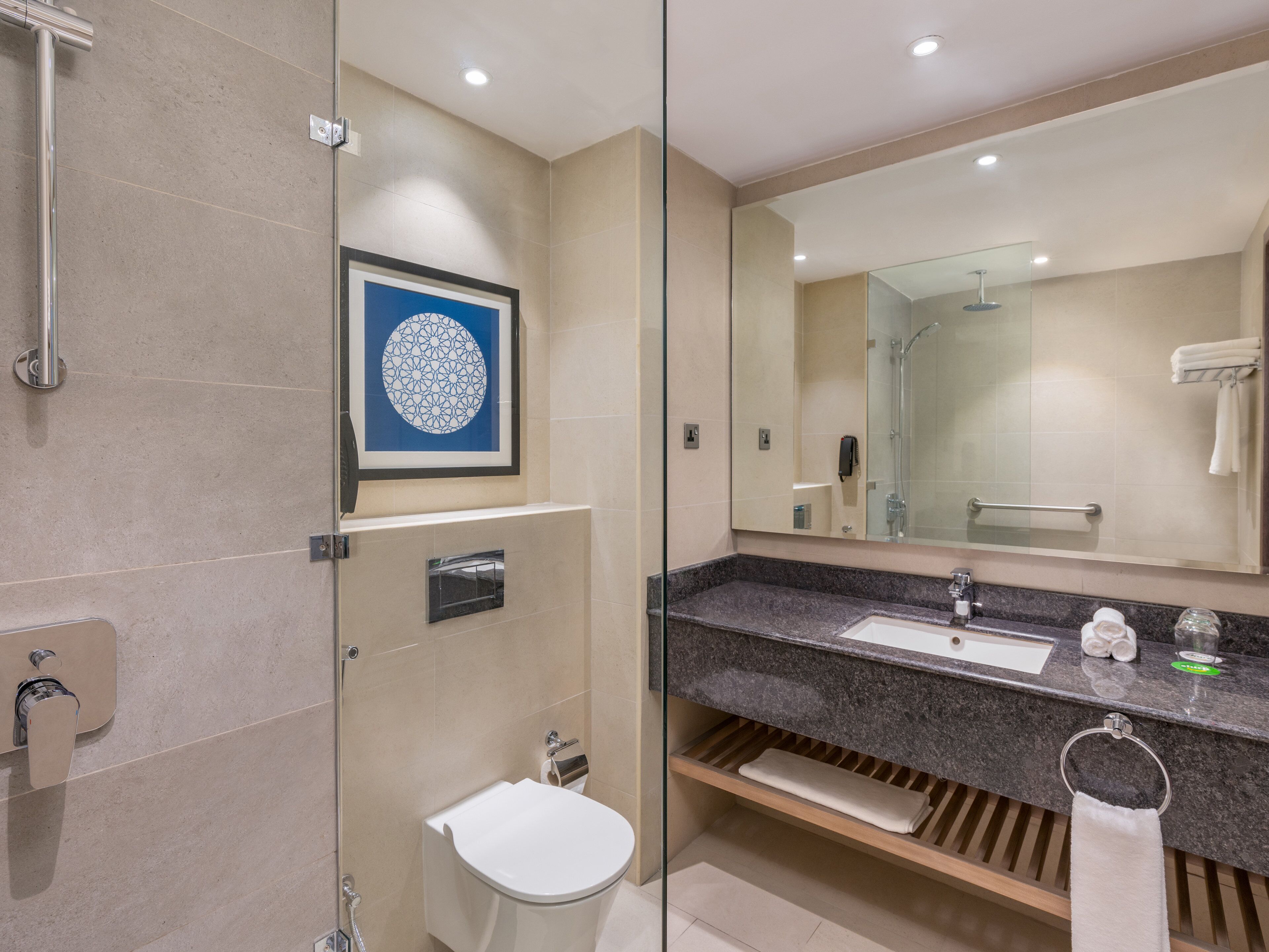 designer toiletries, hair dryer, bathrobes, slippers