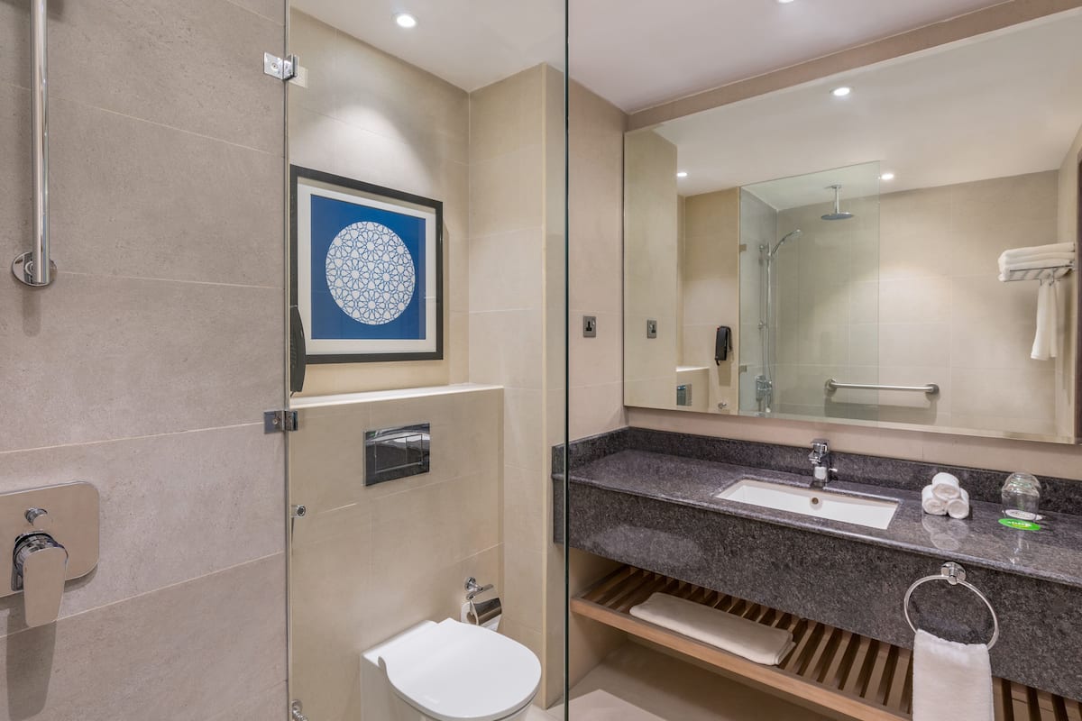 designer toiletries, hair dryer, bathrobes, slippers