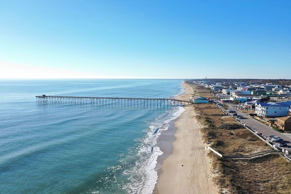 Stroll along the oceanfront pier and enjoy the serene views of the adjacent sandy beach.