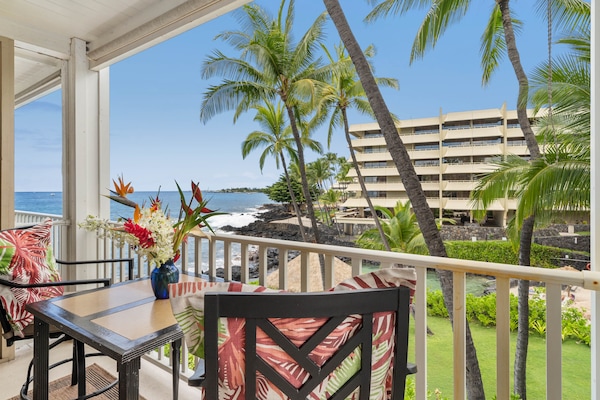 Overlooking a tropical lagoon towards the bay and the light house far off in the distance.