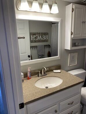Combined shower/tub, hair dryer, towels, toilet paper