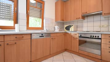 Appartement | Cuisine privée | Chaise haute