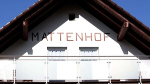 A building with the name MATTENHOF on its facade, featuring a triangular roof and a balcony with railings. - Spacious Apartment in Wehrhalden near Cross Country Skiing (Herrischried)