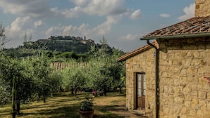 A stone building with a tiled roof, a door, and a window. - Farmhouse Montepulciano Near Vineyards Pool (Montepulciano)